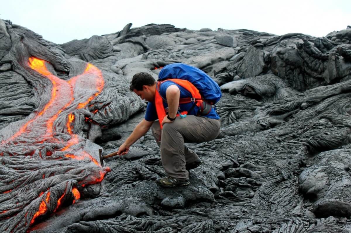 Photography of a person gathering data for writing geology homework